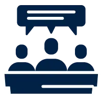 Icon depicting three dark blue human figures seated behind a rectangular panel with a speech bubble above them.
